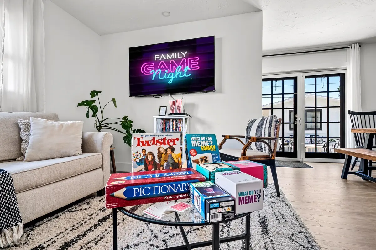 Welcome to your game night HQ! Cozy up with classics like Twister and Pictionary — or binge your favorite shows under neon lights and soft blankets.