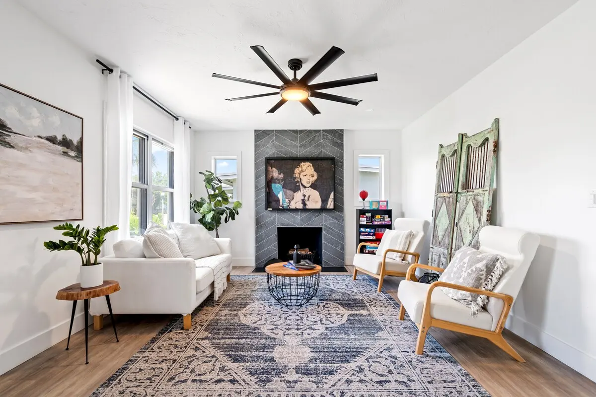 Cozy up in this sunlit living room featuring a custom Marilyn piece made entirely of Sharpie dots by a local artist. The fireplace adds charm (decorative only!), and there’s plenty of space to relax, recharge, or dive into a board game marathon.
