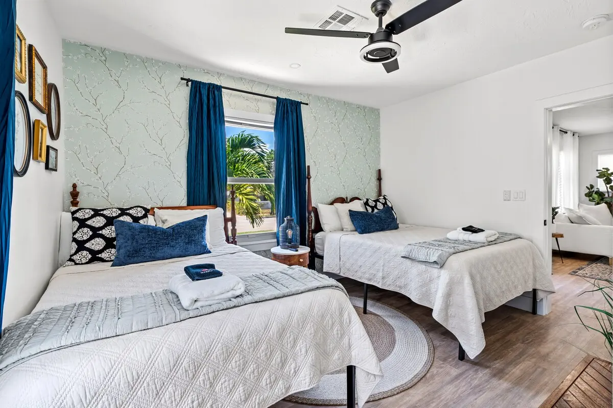 Two full beds for kids, friends, or a low-key pair. Smart TV, whimsical wallpaper, and a Jack & Jill bath.