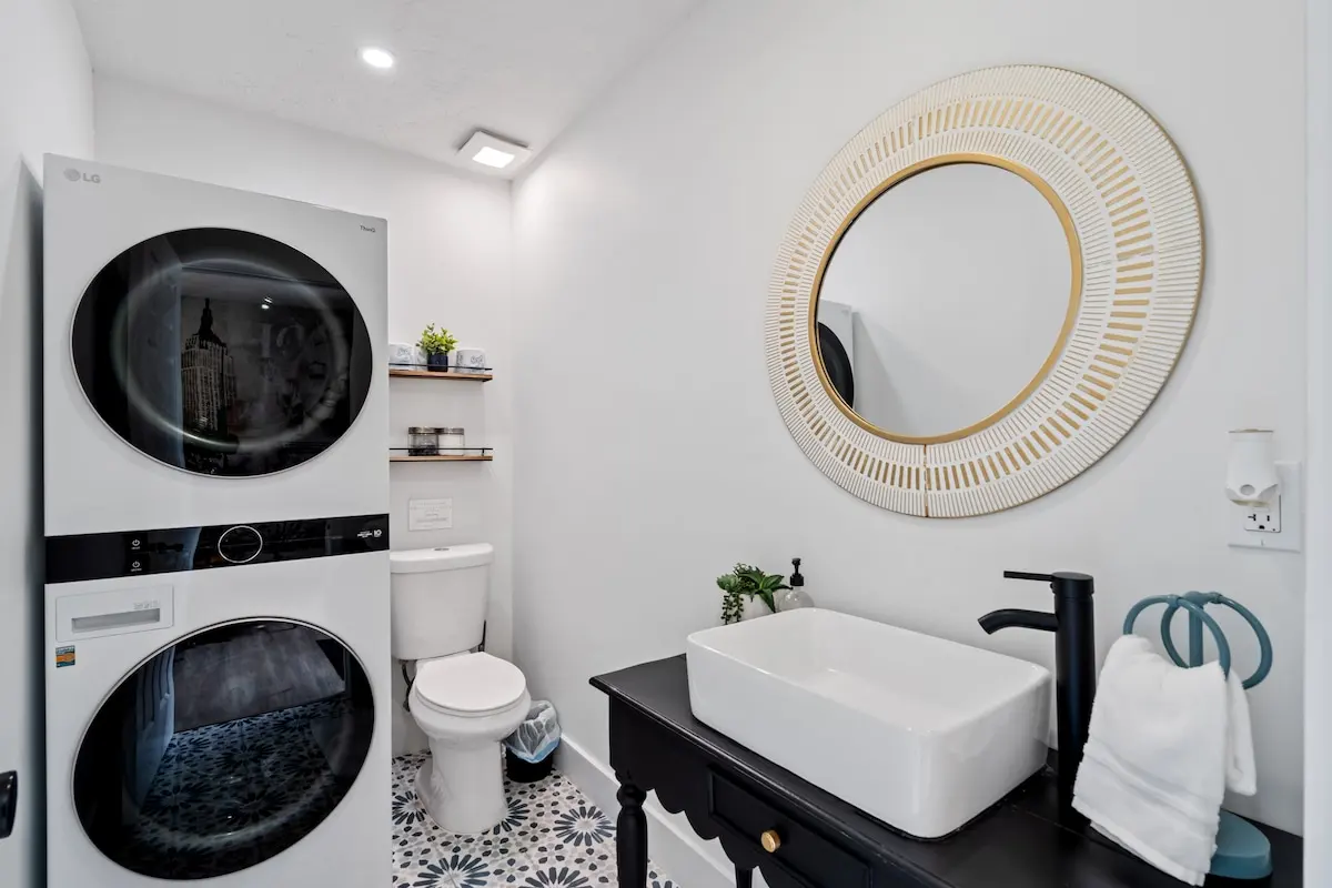 Yes, there’s a full-size washer & dryer plus a stylish half bath — because we believe even laundry should feel luxe.