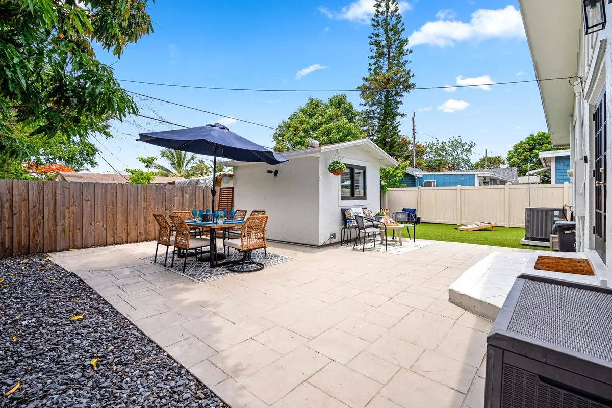 Private backyard with outdoor dining and lounge areas